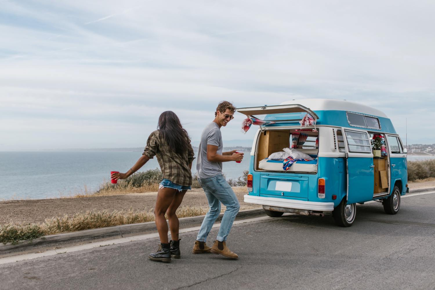 Couple enjoying van life after learning how to add mobile home to their Will.