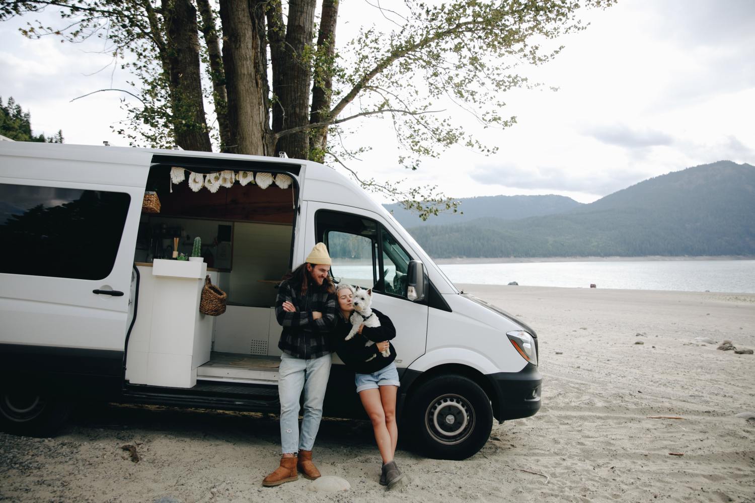 Couple enjoying van life after doing their research on remote digital nomads and estate planning.