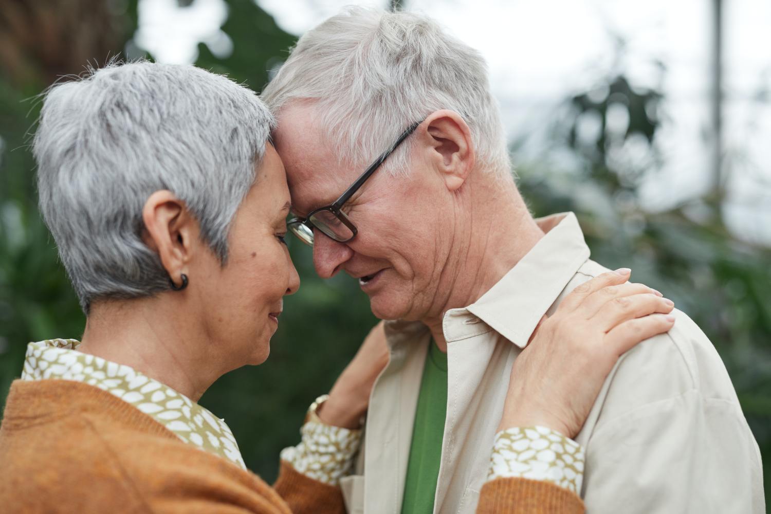 Couple embracing after discussing the differences between retirement planning and estate planning.